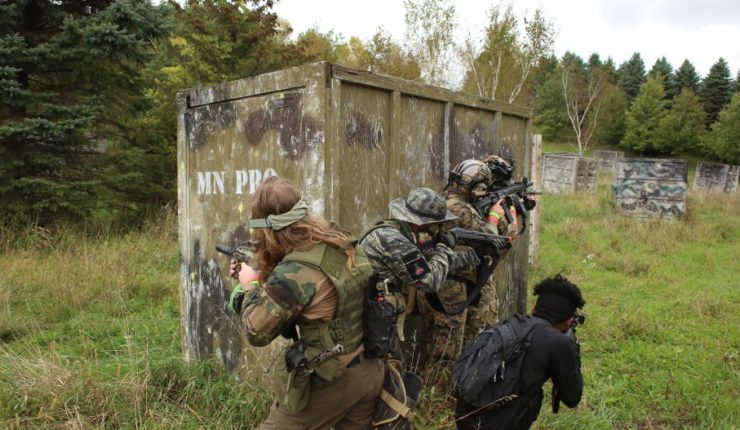 Airsoft Players Take Cover Behind Crate