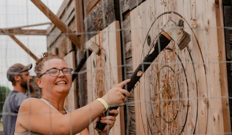 Smiling pulling out an ax